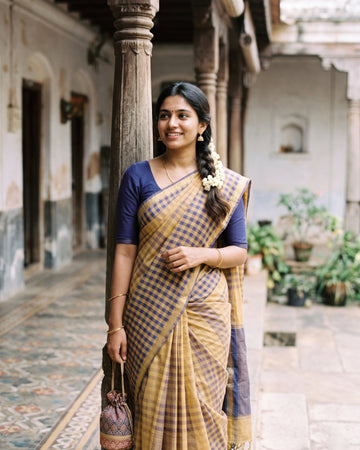 Woman in mustard and indigo checked cotton saree - Arumugaperumal Tex