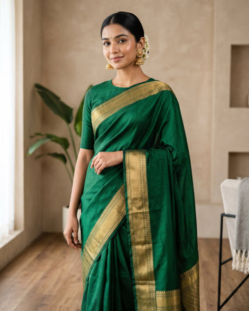 Woman in emerald green silk saree with gold zari border - Arumugaperumal Tex